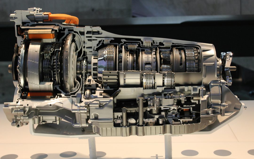 A cross-section of an automatic car transmission showing gears and mechanical components.